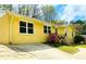 Charming yellow brick home featuring a concrete driveway and well-maintained front yard at 4554 Saint Andrews Dr, Atlanta, GA 30331
