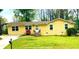 A beautiful single story yellow brick home with a well-manicured lawn and inviting curb appeal at 4554 Saint Andrews Dr, Atlanta, GA 30331
