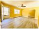 Bright living room with hardwood floors, neutral paint, ceiling fan, and ample natural light at 4554 Saint Andrews Dr, Atlanta, GA 30331
