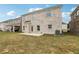 Backyard features an exposed aggregate patio and a lush lawn at 795 Clark Lake Estates Dr, Grayson, GA 30017