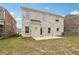 Spacious backyard featuring a patio and a brick house, perfect for outdoor entertaining at 795 Clark Lake Estates Dr, Grayson, GA 30017