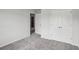 Neutral bedroom features grey carpet, white trim, and a double door closet at 795 Clark Lake Estates Dr, Grayson, GA 30017