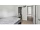 Cozy bedroom with carpet flooring, view into bath and hallway, and a comfortable mattress at 795 Clark Lake Estates Dr, Grayson, GA 30017