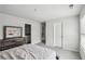 Bedroom showcases grey carpet, bright natural light, and rustic wood furniture at 795 Clark Lake Estates Dr, Grayson, GA 30017