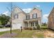 Attractive two-story brick home with a well-maintained lawn and a welcoming front porch at 795 Clark Lake Estates Dr, Grayson, GA 30017