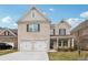 Beautiful two-story brick home with a two-car garage and well-manicured lawn at 795 Clark Lake Estates Dr, Grayson, GA 30017