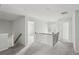 Neutral hallway features grey carpet, white trim, and an iron railing at 795 Clark Lake Estates Dr, Grayson, GA 30017