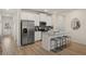 Modern kitchen featuring stainless steel appliances, granite countertops, and a kitchen island at 1012 Merritt Dr, Villa Rica, GA 30180