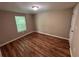 Inviting bedroom filled with hardwood floors, natural light and neutral color tones at 1938 Main Nw St, Atlanta, GA 30318