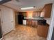 Traditional kitchen offers ample counter space, wood cabinets, and essential appliances at 1938 Main Nw St, Atlanta, GA 30318