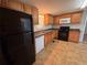 Efficient kitchen features black appliances, generous counter space, and ample storage at 1938 Main Nw St, Atlanta, GA 30318