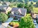 Aerial view of the property showcasing the roof, yard, and surrounding landscape at 2694 Dawning Day Dr, Dacula, GA 30019