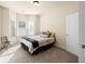Bright bedroom with neutral carpet, large window, and a cozy atmosphere at 2694 Dawning Day Dr, Dacula, GA 30019