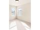 Bright bedroom with neutral walls and carpet features large windows with natural light at 2694 Dawning Day Dr, Dacula, GA 30019
