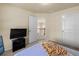 Cozy bedroom with closet, television, and view into the second floor hallway at 2694 Dawning Day Dr, Dacula, GA 30019