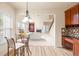Cozy breakfast nook next to kitchen with view into living room with fireplace at 2694 Dawning Day Dr, Dacula, GA 30019