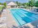Large community pool with lap lanes, lounge chairs, and clubhouse in a serene setting at 2694 Dawning Day Dr, Dacula, GA 30019