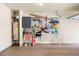 Well-organized garage with storage cabinets, slatwall, and epoxy flooring at 2694 Dawning Day Dr, Dacula, GA 30019