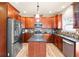 Beautiful kitchen with stainless steel appliances, granite counters, and center island at 2694 Dawning Day Dr, Dacula, GA 30019