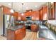 Modern kitchen featuring stainless steel appliances, dark granite countertops, and an island at 2694 Dawning Day Dr, Dacula, GA 30019