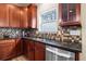 Modern kitchen featuring sleek stainless steel dishwasher and beautiful cabinetry at 2694 Dawning Day Dr, Dacula, GA 30019