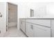 Modern bathroom features a double vanity and tiled shower/tub at 702 Dodd Ln # 159, Buford, GA 30518