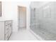 A luxurious bathroom features a marble shower and a sleek vanity at 702 Dodd Ln # 159, Buford, GA 30518