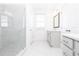 A pristine bathroom features a glass shower and modern vanity at 702 Dodd Ln # 159, Buford, GA 30518