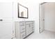 Modern bathroom boasts a large mirror and ample cabinet space at 702 Dodd Ln # 159, Buford, GA 30518