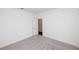 Bright bedroom features neutral carpet, white walls, and trim at 702 Dodd Ln # 159, Buford, GA 30518