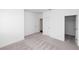 This cozy bedroom with neutral carpet and white walls features a closet at 702 Dodd Ln # 159, Buford, GA 30518