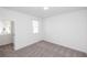 A bright bedroom boasts plush carpeting and ample natural light at 702 Dodd Ln # 159, Buford, GA 30518