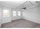An airy bedroom features a ceiling fan and windows for natural light at 702 Dodd Ln # 159, Buford, GA 30518