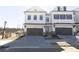 Charming townhouse with a two-car garage, modern architecture, and well-maintained driveway at 702 Dodd Ln # 159, Buford, GA 30518