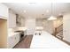 Bright, open kitchen featuring sleek countertops, modern appliances, and recessed lighting at 702 Dodd Ln # 159, Buford, GA 30518