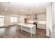 Spacious new kitchen featuring an expansive island, sleek appliances and ample cabinet space at 702 Dodd Ln # 159, Buford, GA 30518