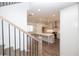View of new kitchen with large island and modern appliances from the stairway at 702 Dodd Ln # 159, Buford, GA 30518