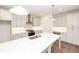 Modern kitchen featuring grey cabinets, large island, and stainless steel appliances at 702 Dodd Ln # 159, Buford, GA 30518
