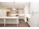Modern kitchen featuring grey cabinets, large island, and stainless steel appliances at 702 Dodd Ln # 159, Buford, GA 30518