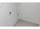 A bright laundry room boasts tile flooring and utility connections at 702 Dodd Ln # 159, Buford, GA 30518