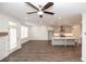 Bright living room with wood-look floors, fireplace and modern kitchen at 702 Dodd Ln # 159, Buford, GA 30518