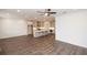 Spacious living room and kitchen with modern island and wood-look floors at 702 Dodd Ln # 159, Buford, GA 30518