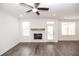 Cozy living room features a fireplace, wood-look floors, and plenty of natural light at 702 Dodd Ln # 159, Buford, GA 30518