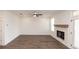 Living room featuring wood-look floors and a fireplace with wood mantle at 702 Dodd Ln # 159, Buford, GA 30518