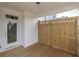 A wood deck patio with fenced walls and a white door at 702 Dodd Ln # 159, Buford, GA 30518