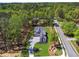 Aerial view of the home displaying the lush greenery and large lot at 100 Maison Ct, Roswell, GA 30076