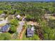 An aerial view displays the surrounding community and ample green space at 100 Maison Ct, Roswell, GA 30076