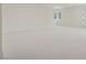 A spacious room with neutral carpet, white walls, a window, and white trim at 100 Maison Ct, Roswell, GA 30076