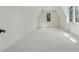 A bright room with neutral carpet, white walls, and a dormer window with green view at 100 Maison Ct, Roswell, GA 30076
