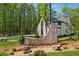 Landscaped entrance featuring a brick sign with the community name, 'Maison.' at 100 Maison Ct, Roswell, GA 30076